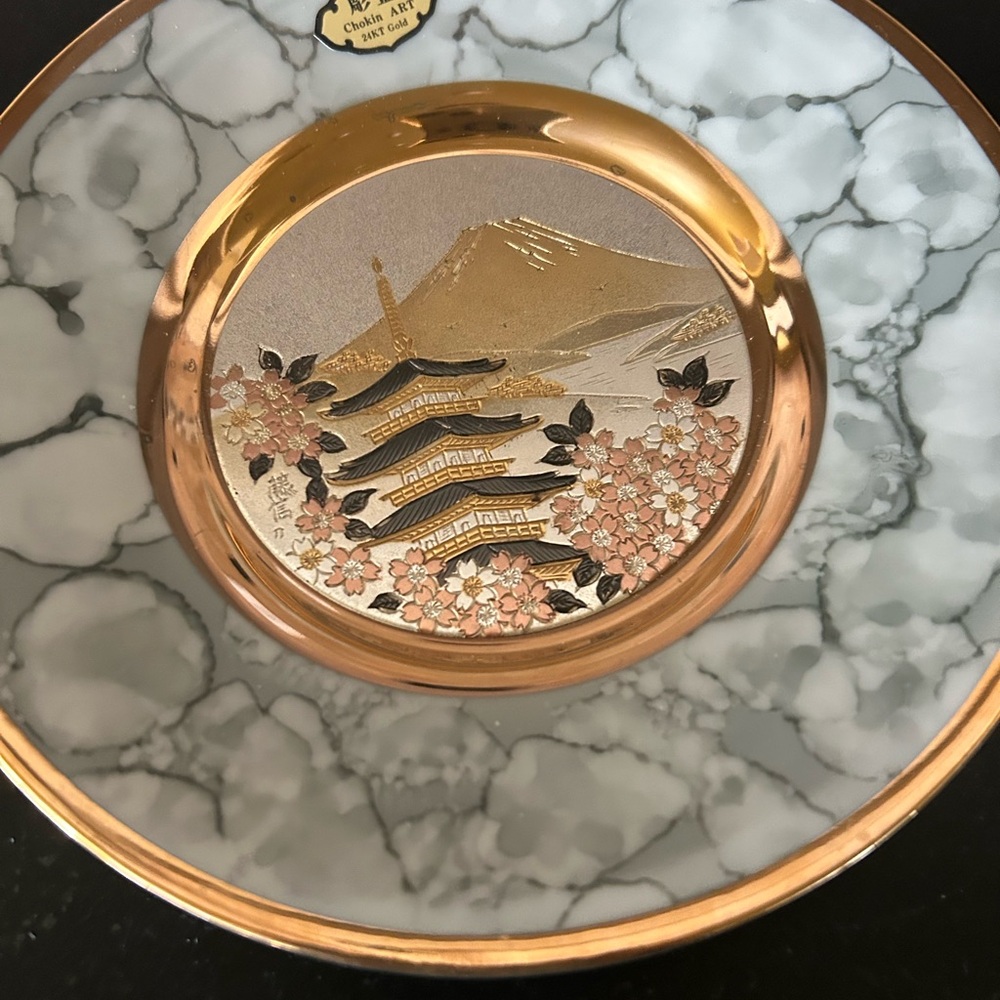 Gold and Gray Decorative Plate with Pagoda Design